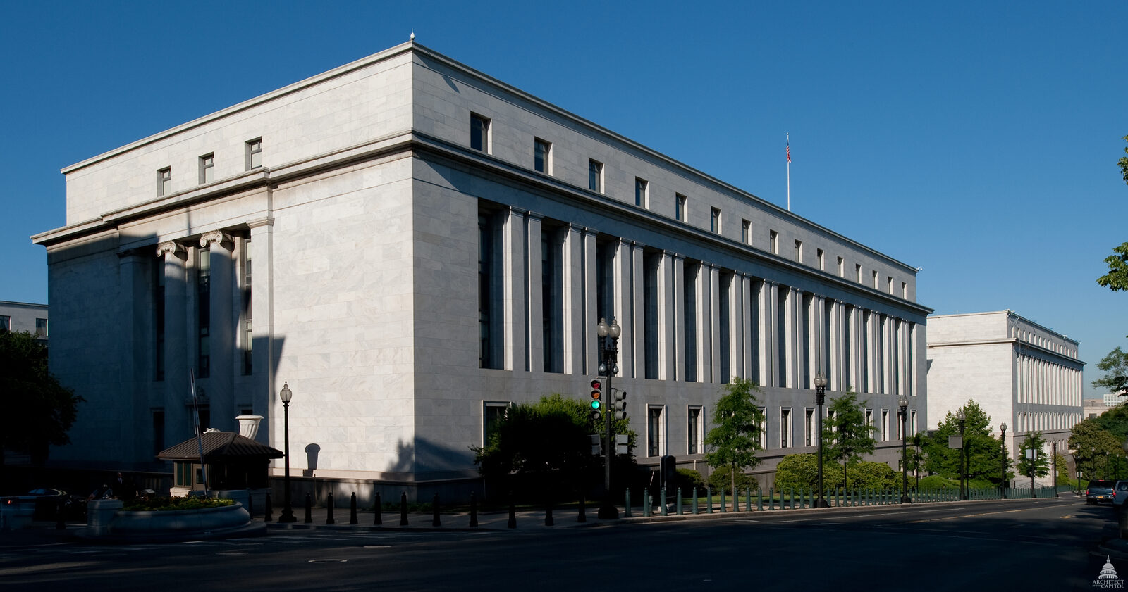 Exterior of the Rayburn House Office Building in Washington, D.C., a white marble building on a pink granite base