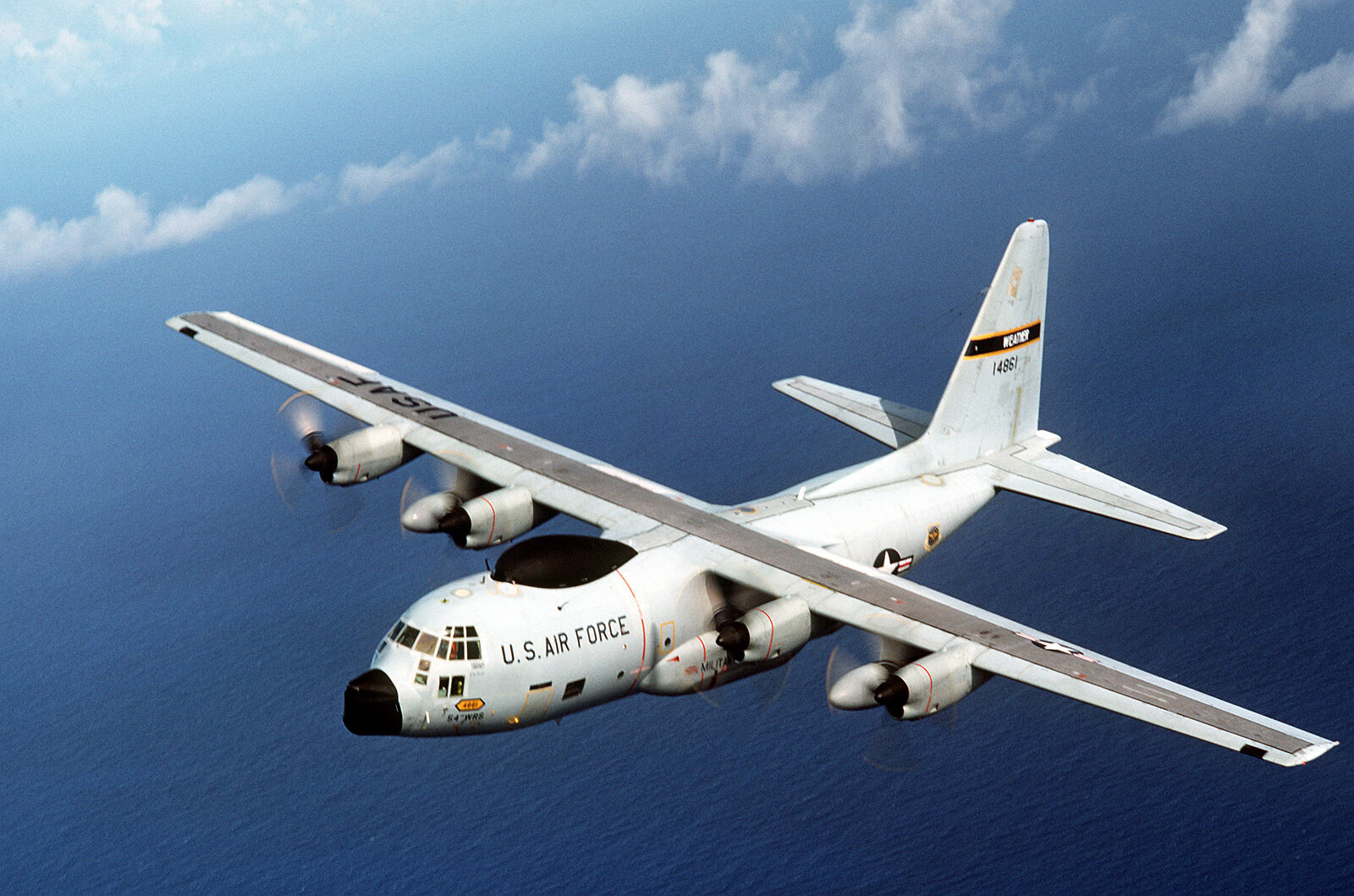 A four-engined Lockheed WC-130H Hercules weather reconnaissance aircraft of the 54th Weather Reconnaissance Squadron in flight above cloud.