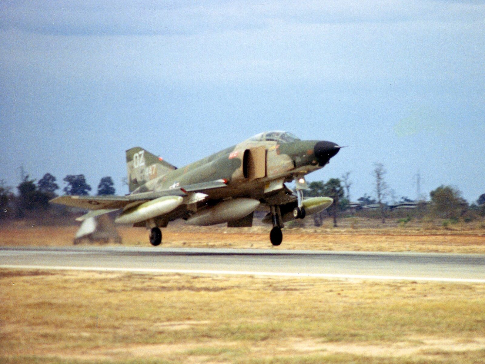 A US Air Force McDonnell RF-4C Phantom II reconnaissance jet on final approach, landing gear down, at Udorn Royal Thai Air Force Base in 1968.