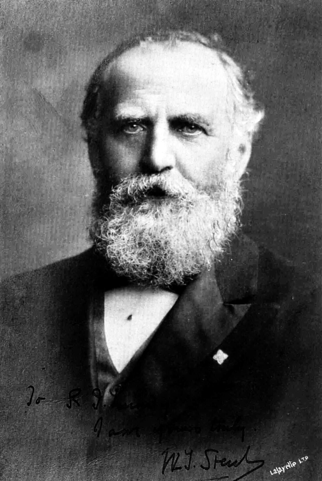 Studio portrait photograph of the Victorian journalist William Thomas Stead, bearded, in dark formal dress